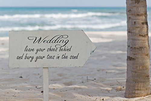 Wedding-Sign-Leave-Shoes-In-Sand