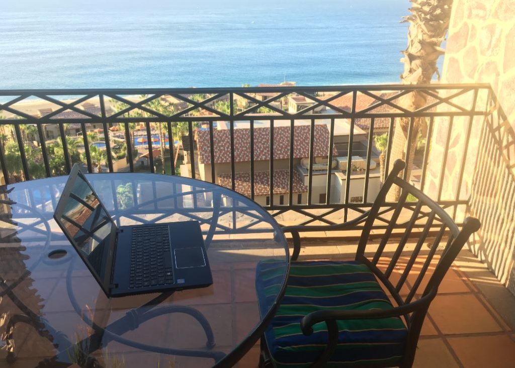 working-while-travelling - working-from-my-balcony-ocean-view