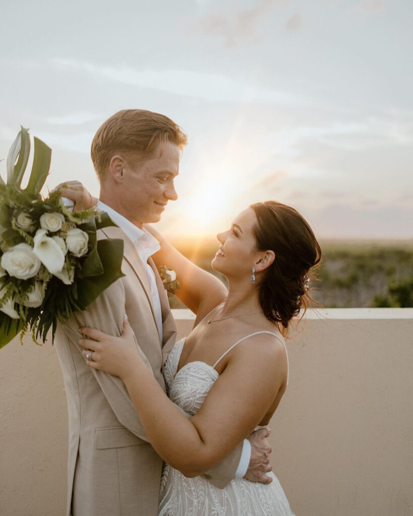 couple standing in the sunset during their destination wedding in mexico